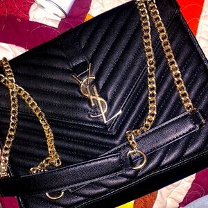 Large, black, lightly used YSL women’s designer handbag.